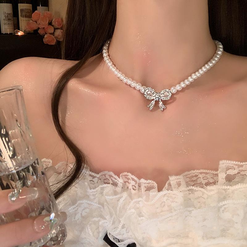 French temperament pearl necklace women's 2025 new diamond-encrusted bow collarbone chain light luxury high-end dress accessories