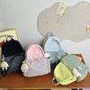 High-value bow ins niche plaid schoolbag for female junior high school students, casual and lightweight college students, travel backpack.