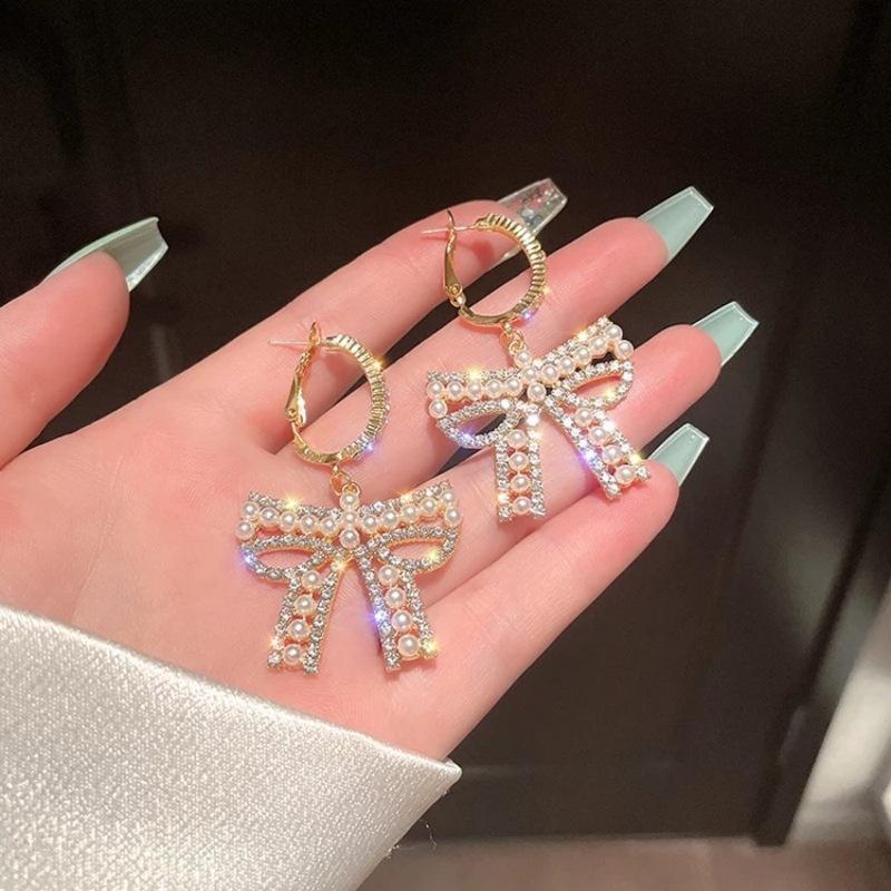 Celebrity bow pearl fringed earrings women's light luxury high-end earrings fashionable exquisite versatile earrings