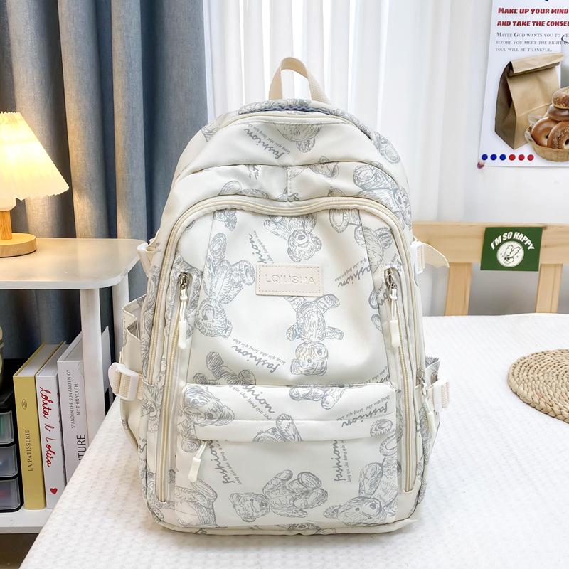 School bag for female junior high school students, simple and versatile printed bear niche design, college student computer backpack tide
