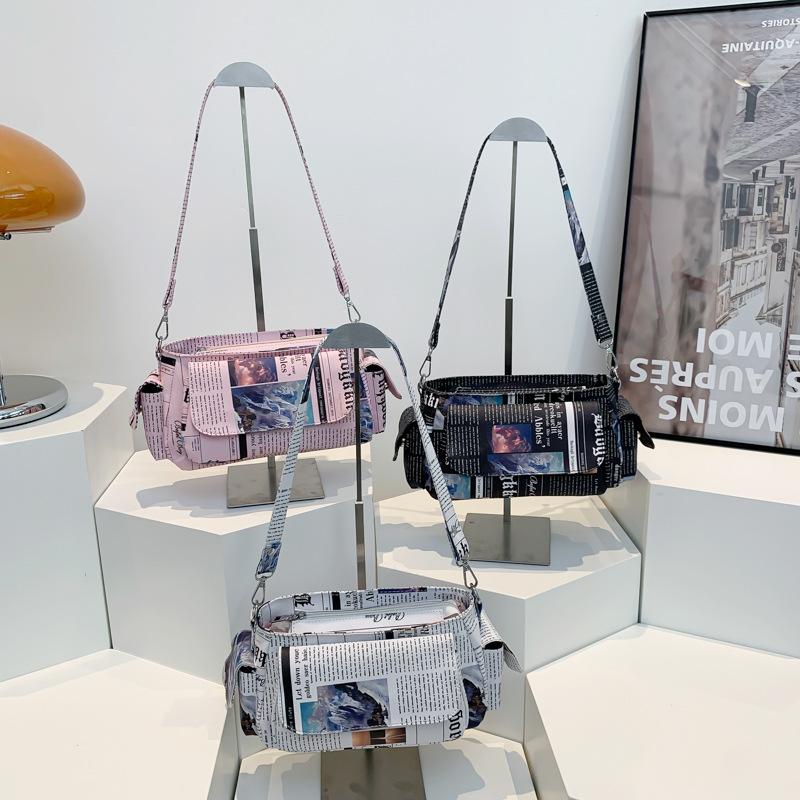 Personalized newspaper bag summer 2025 new Korean version fashion printing trend ins women's shoulder armpit bag pu