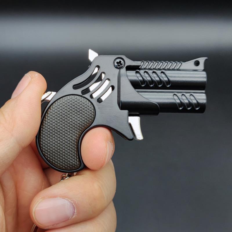 1Pcs Mini Keychain Metal Rubber Band Gun Game Toy Gun Launcher საბავშვო სიმულაციური პისტოლეტი სათამაშოები საჩუქრები საკიდი