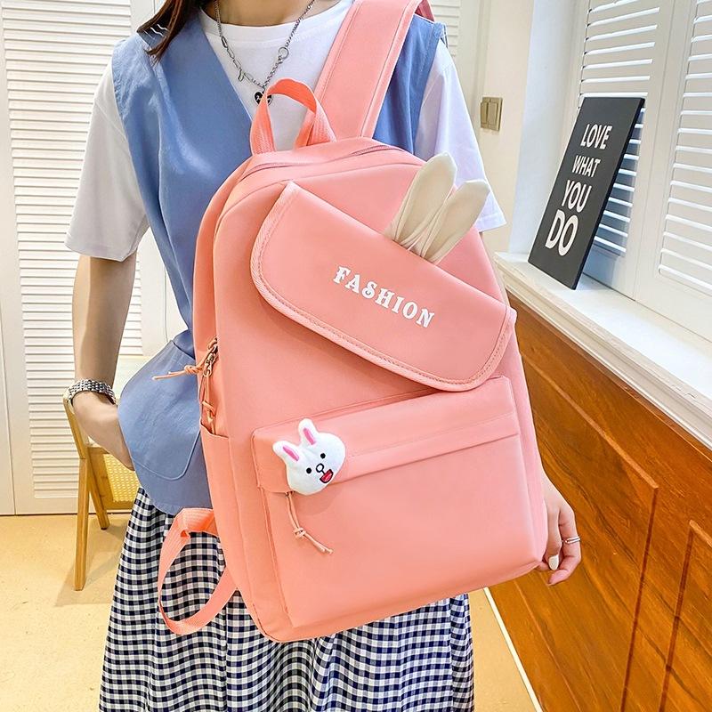 New girl backpack, primary and secondary school schoolbag, make-up bag, four-piece rabbit ear class backpack