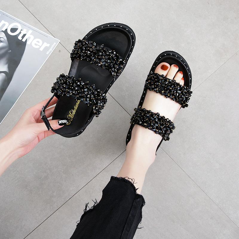 2025 Sommer neue Zehenfreie Dicksohlige Ein-Wort-Schnallen-Sandalen Damen Koreanische Version Vielseitige Lässige Flachboden-Strand-Römersandalen