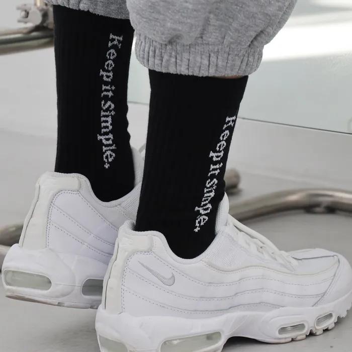 Black lettering sports socks keep it simple.