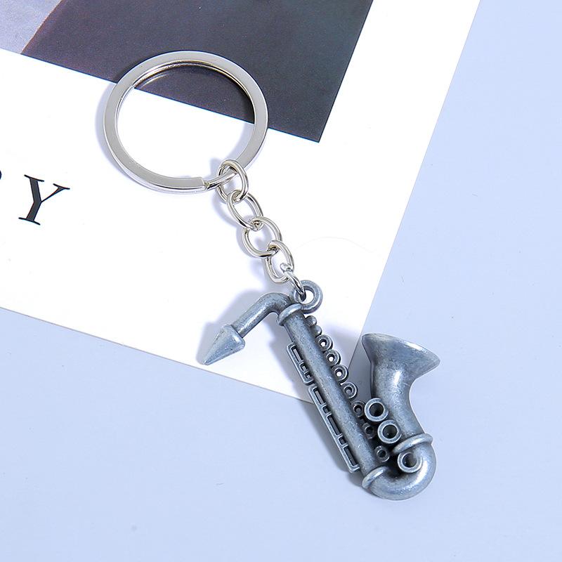 Mini nástroj Saxofon Přívěsek na klíče do auta Mini hudební nástroj Kovový kroužek na klíče Příslušenství Přívěsek na tašku Dárky na hudební festival
