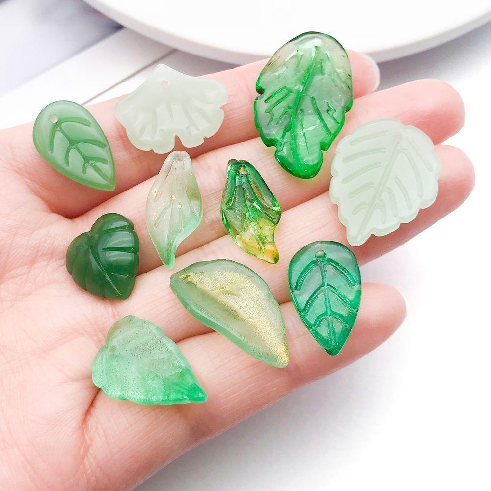 Set of 20 Green Transparent Faux Glass Leaf Pendants for DIY Bracelets, Necklaces, and Video Accessories.