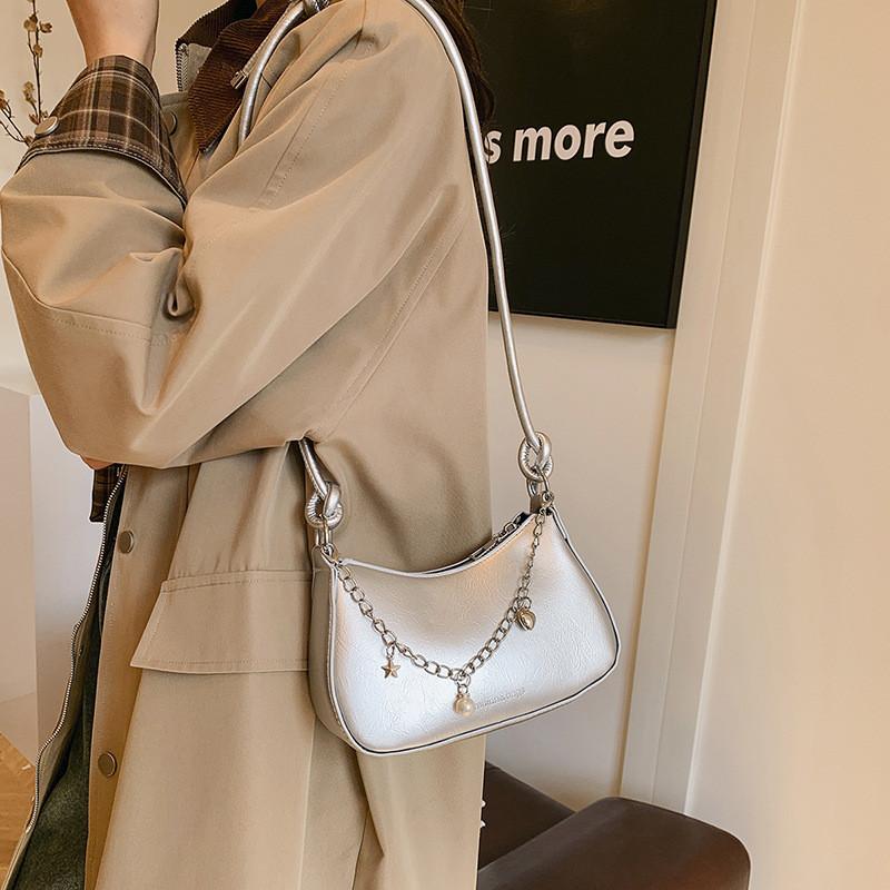 Fashionable Female Crossbody Bag With Soft Structure And Chain Accent For Summer Style