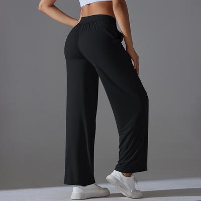 Pantalon de sport taille haute pour femme, coupe ample, effet peau de pêche, idéal pour le yoga et le fitness.