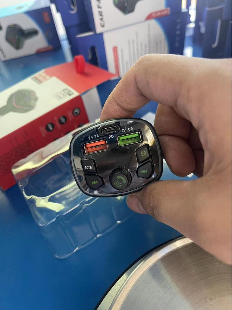 Car Bluetooth MP3 Player with Hands-Free Call, Voice Broadcast, PD Fast Charging, and USB Flash Drive.