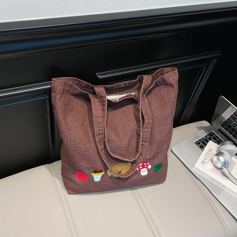 Casual canvas bag design sense niche women's bag 2025 new cartoon printed tote bag large capacity shoulder bag