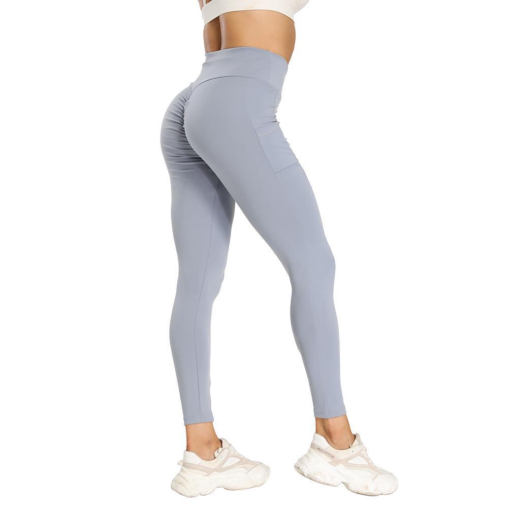 European & American Athletic Yoga Leggings with Pockets - High-Waisted, Hip-Lifting, Ideal for Fitness & Running.