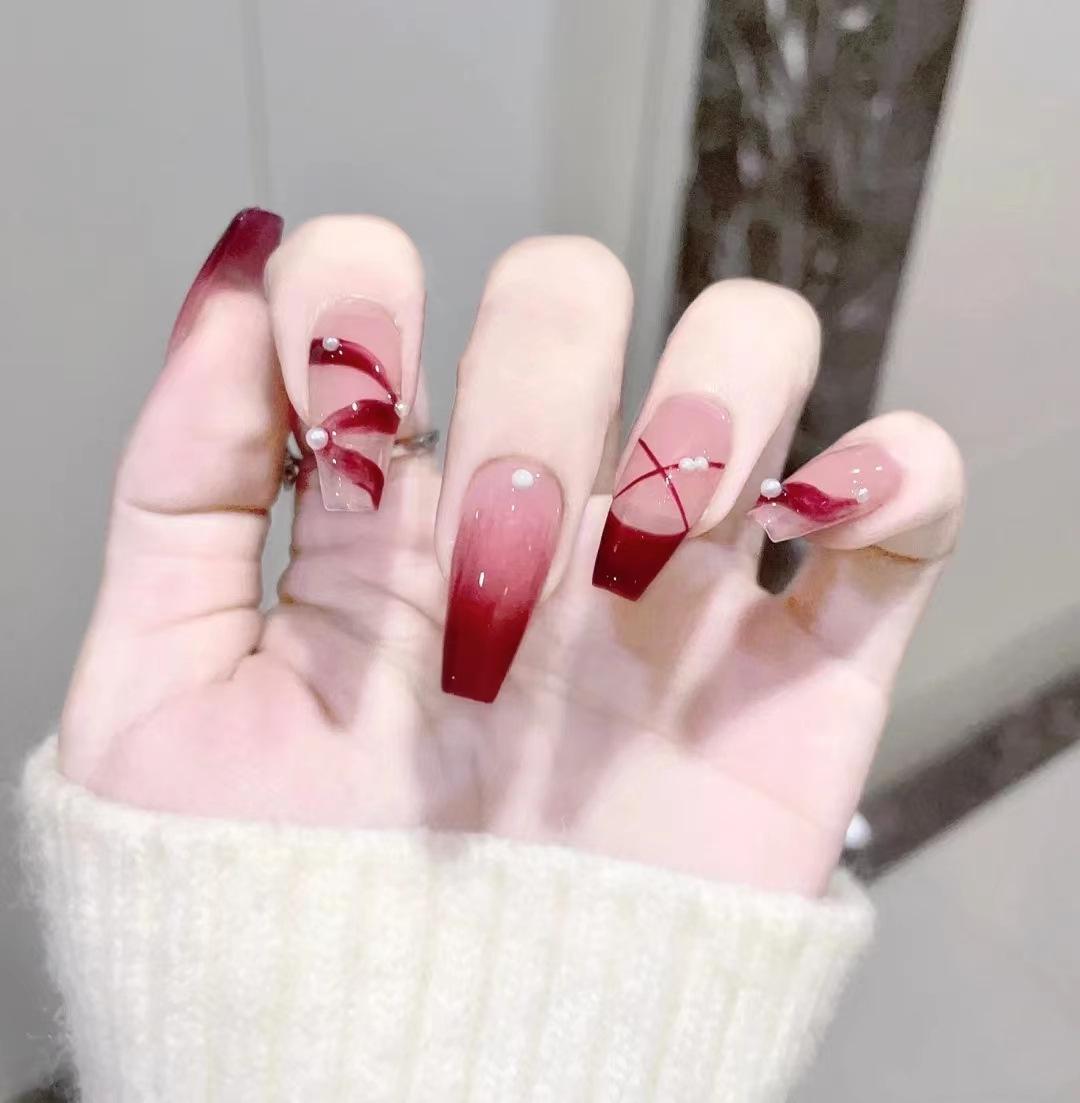 

B431 Blush Gauze Wearable T-shaped Nail Tips with Pearl Ribbon Embellishments.