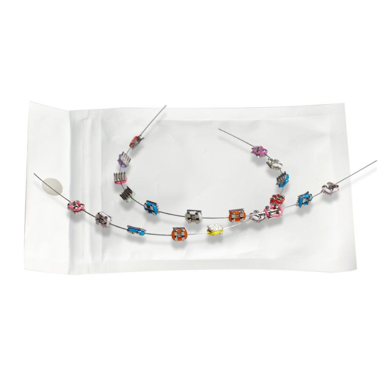 

Мода 1 пара брекетов для зубов Разноцветное временное украшение зубов Металлические брекеты Дуги Ортодонтические лигатурные резинки Высокое качество красный