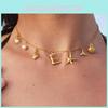 Trendy Inspired Ocean Gold Plated Stainless Steel Necklace Featuring Seashell And Starfish Accents Ideal For Com Fashionable