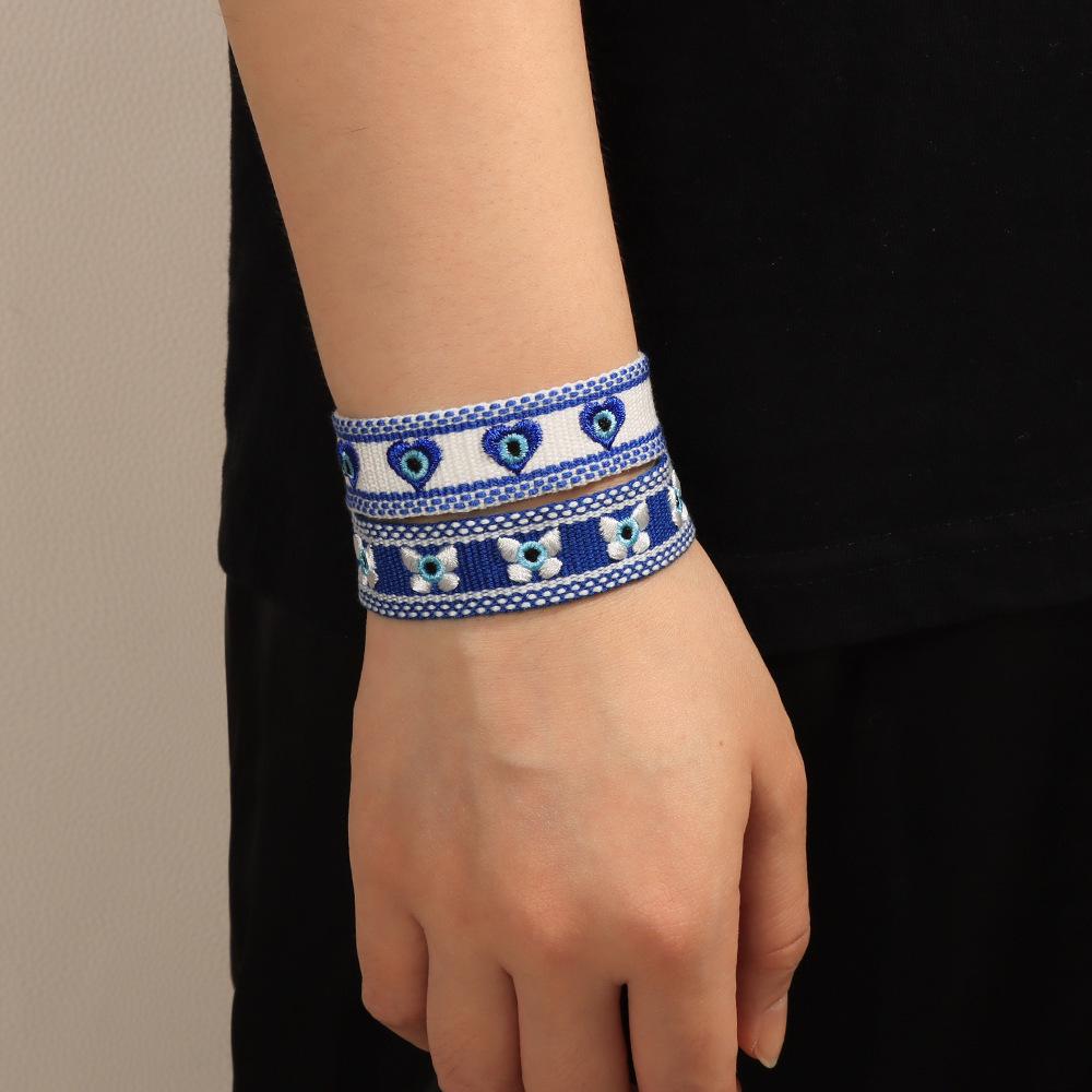 Blue-Eyed Lucky Charm Tassel Bracelet: Handmade European & American Style Woven Demon Eye for Women
