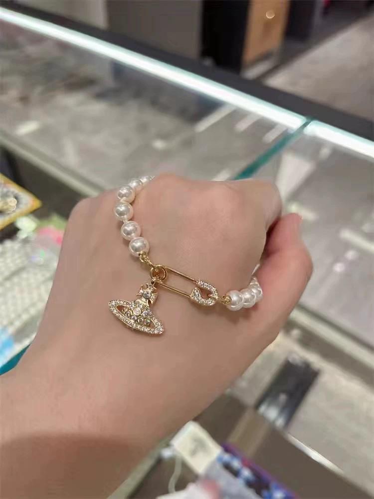 

Брошь-подвеска «Императрица Доуэгер» - Классический чокер и цепочка «Сатурн» до ключиц, стиль «легкая роскошь»