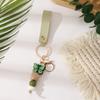 European & American Sweet Butterfly Daisy Silicone Beaded Keychain with Leather Bow Pendant
