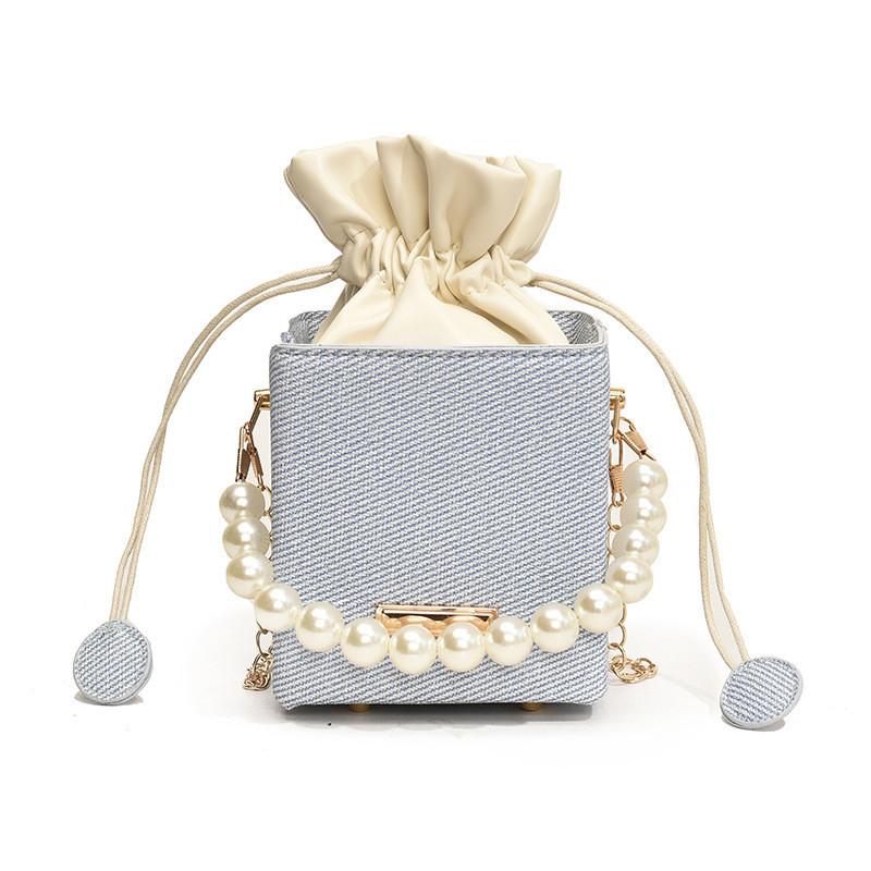 

Street Style Chic Pearl Handle Bucket Bag For Women 2024 Summer New Luxury Striped Shoulder Chain Bag синій