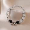 TS0105 Black Cat's Eye Bell Bracelet