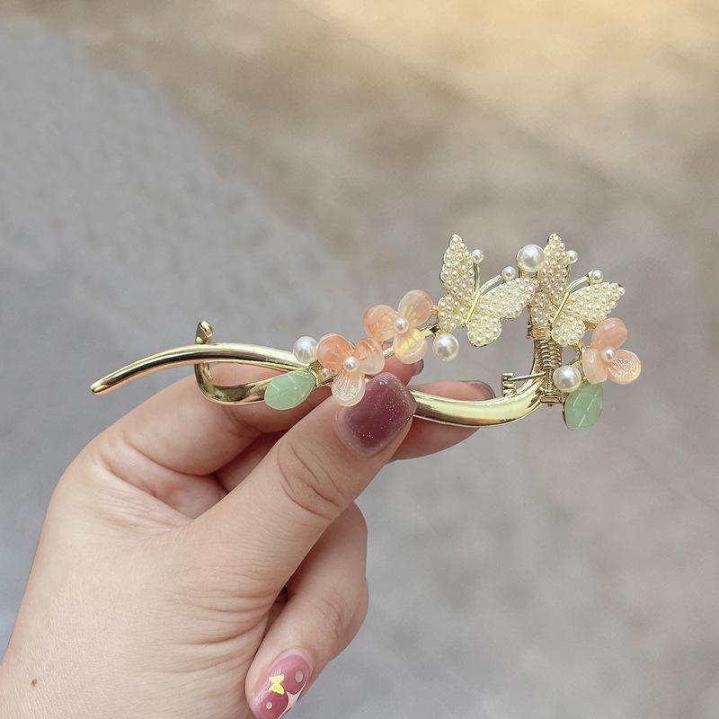 Factory direct fashion flower pearl twist clip elegant hairpin Internet celebrity head spring clip
