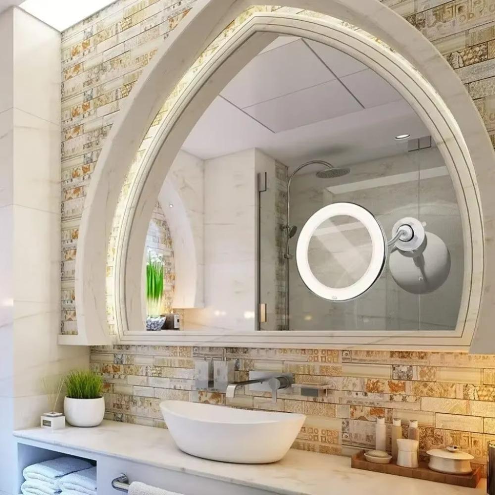 Miroir de maquillage rotatif à 360° avec grossissement x10, fixation murale, éclairage LED et commandes tactiles.