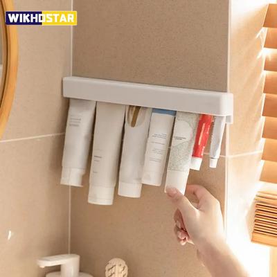 Nástěnný koupelnový držák na zubní pastu LongToothpaste Holder Multifunkční prostorově úsporný držák na zubní pastu