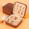 Tragbare Schmuckaufbewahrungsbox Reise-Schmuckorganizer-Etui Lederaufbewahrung Ohrringe Halskette Ring Schmuckdisplay