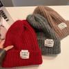 Chapeau de laine coréen doux et mignon à grosse tête Automne et hiver Décontracté Polyvalent Chapeau de tête Coupe-vent Oreilles chaudes Chapeau tricoté