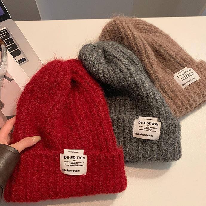 Chapeau de laine coréen doux et mignon à grosse tête Automne et hiver Décontracté Polyvalent Chapeau de tête Coupe-vent Oreilles chaudes Chapeau tricoté