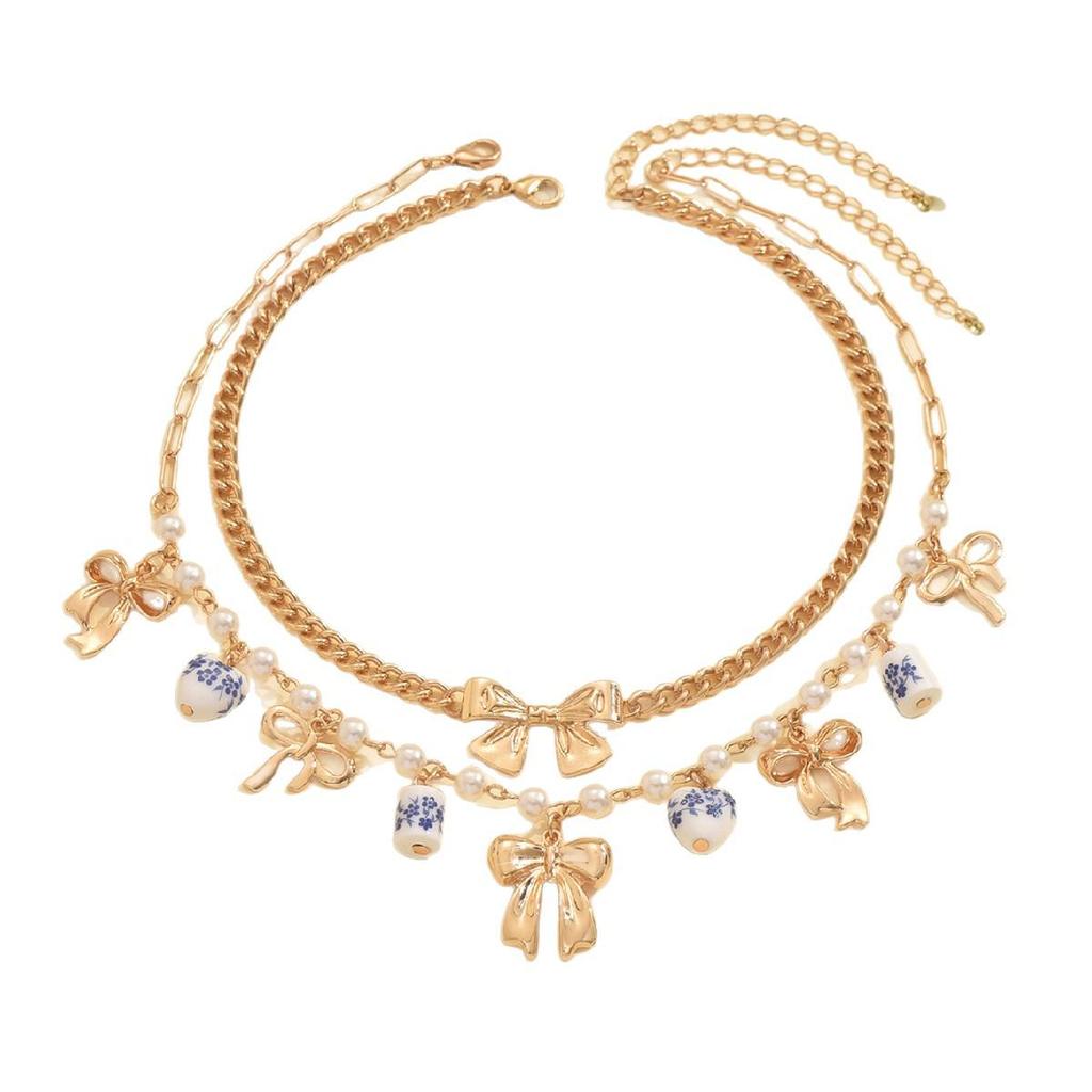 Doppellagige Perlen-Schleifen-Anhänger-Halskette - Modische Keramik-Schlüsselbeinkette