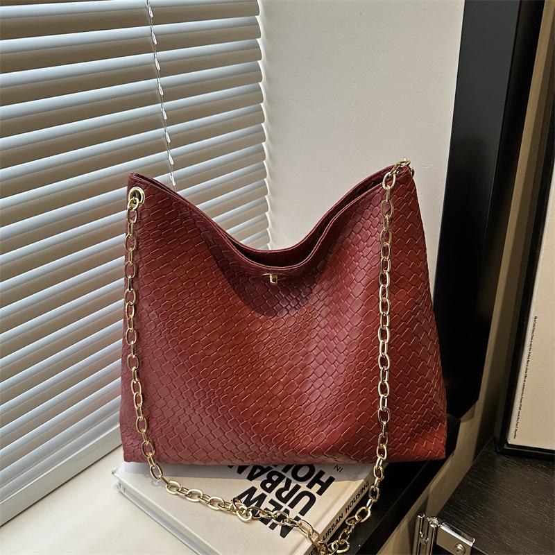 

Niche retro commuter messenger bag bag large capacity student versatile high sense single shoulder French underarm bag women коричневий