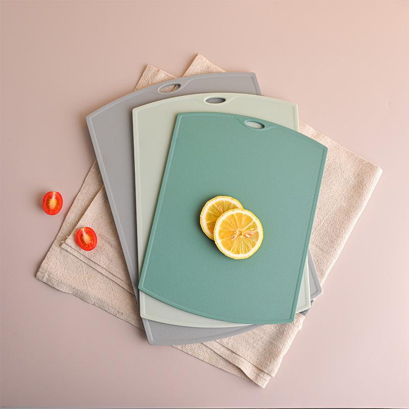 Dual-Sided Kitchen Cutting Board: Durable, Hangable Plastic Board for Meat, Fruits, and Cooked Food.