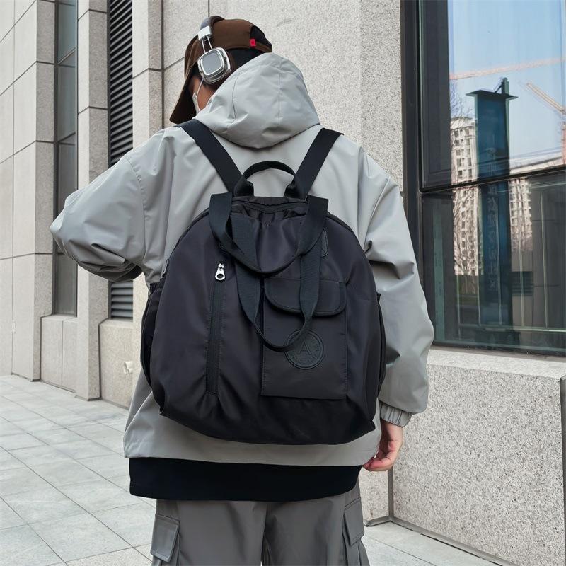 Schoolbag new model has no sense of three-purpose backpack men's lazy wind large-capacity business trip messenger bag portable backpack fitness bag