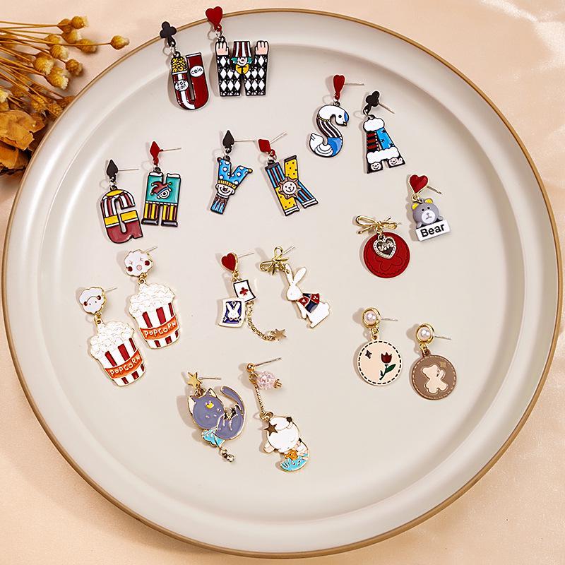 Silver Needle Niedliche Cartoon Quastenohrringe mit Schleife & Blumendesign Popcorn Legierung Ohrringe