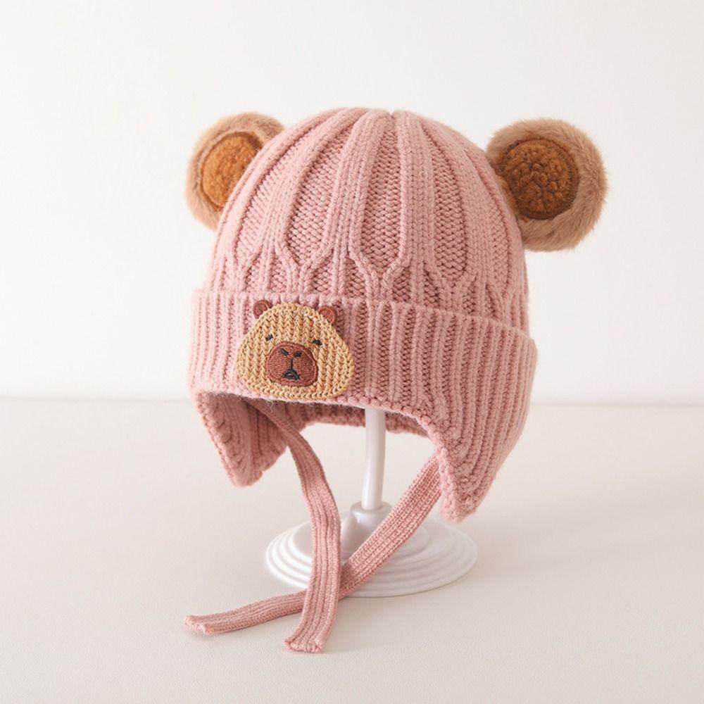 

Зимова тепла шапка. Вітрозахисні пуловери. Модні навушники для дитини рожевий