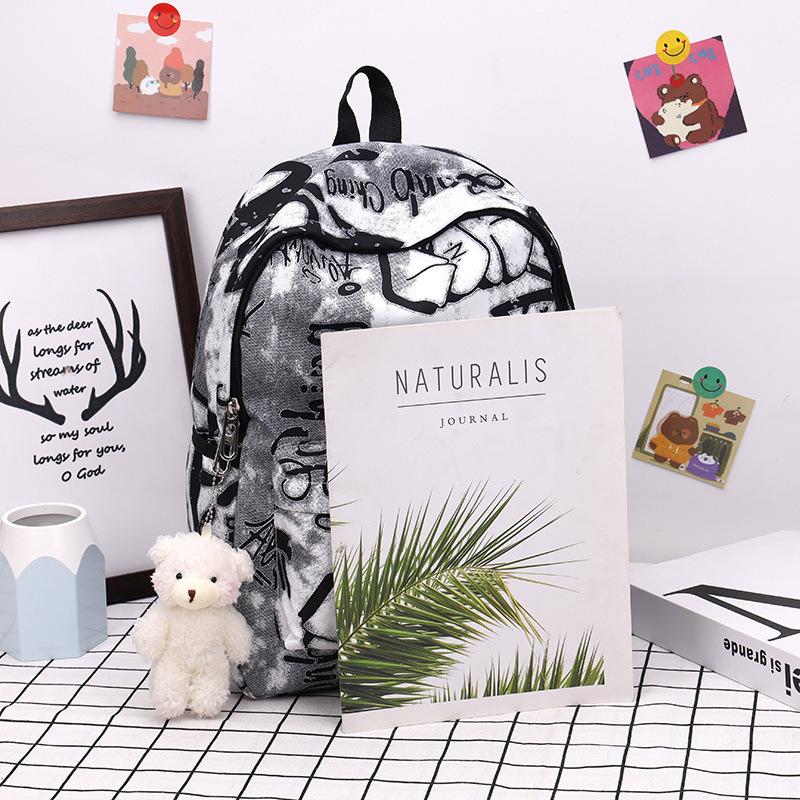 Sac à dos scolaire sac à dos mode et simple sac à dos pour élèves du collège et du lycée japonais version coréenne sac à dos Mori sac à dos tendance graffiti