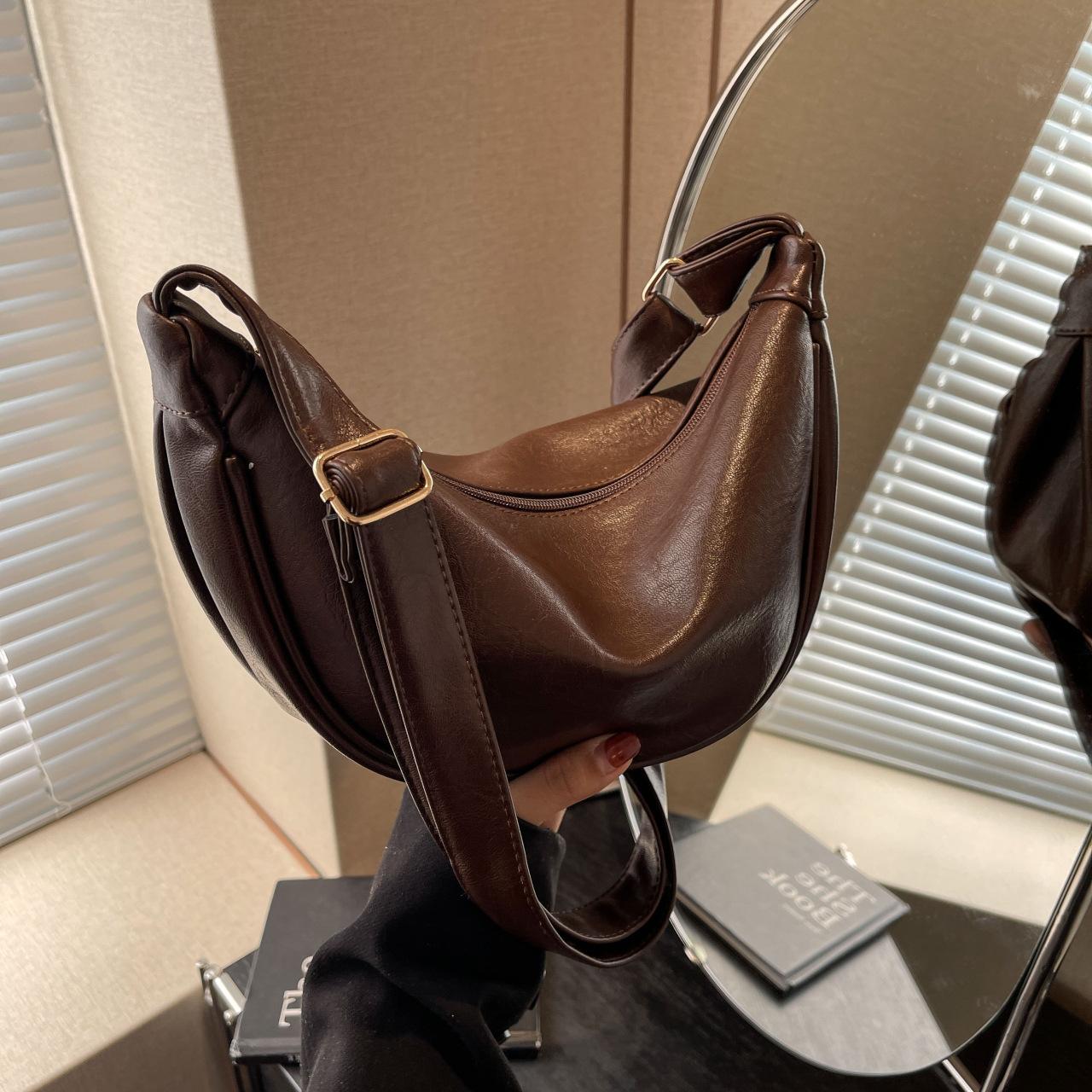 

One shoulder crossbody retro fashion underarm bag saddle bag simple casual dumpling bag premium soft PU bag women темно-коричневого кольору