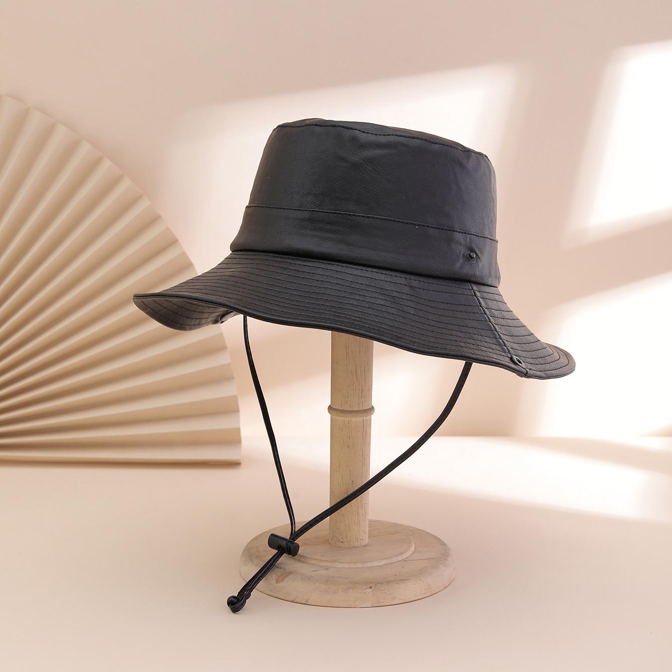 

Simple and casual pure-color PU reversible hat with drawstring and rope. Waterproof sun hat suitable for outdoor outings. One Size