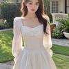 Autumn Style White A-line Dress: Slimming Elegant Design with Waist-Cinching Ruffles and Puff Sleeves.