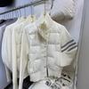 Wear a small short white goose down jacket for women's autumn and winter new knitted splicing niche