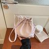 2026 New Drawstring Bucket Bag for Women Soft Leather Crossbody Bag with Ball Charm Mini Shoulder Handbag for Daily Shopping