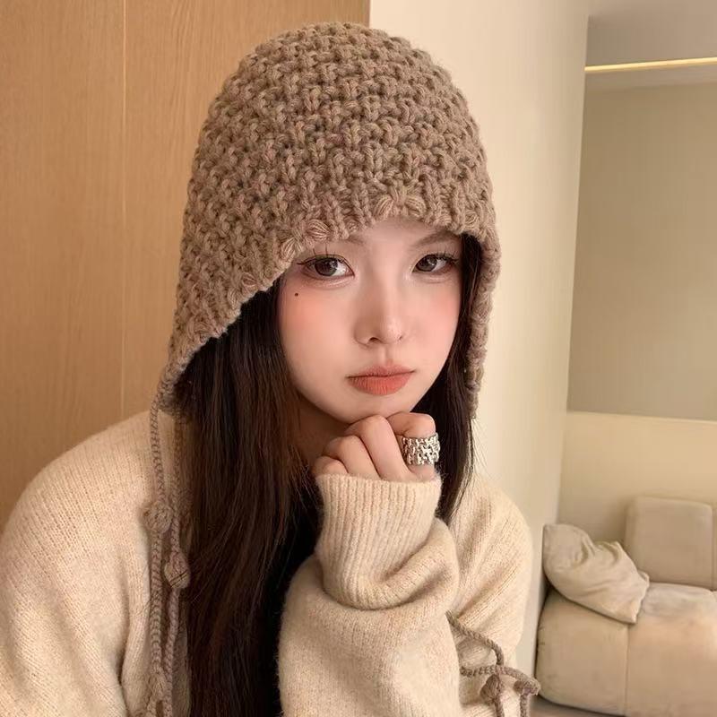 Autumn and winter hand-woven hollowed-out bald hat Warm wool hat Women's fringed ear protector Knitted hat