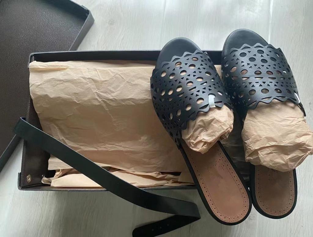 Leather Hollowed-out Laser Engraved Leather One-word Flat-bottomed Cool Slippers Women's Fashion 2025 New Summer Sandals