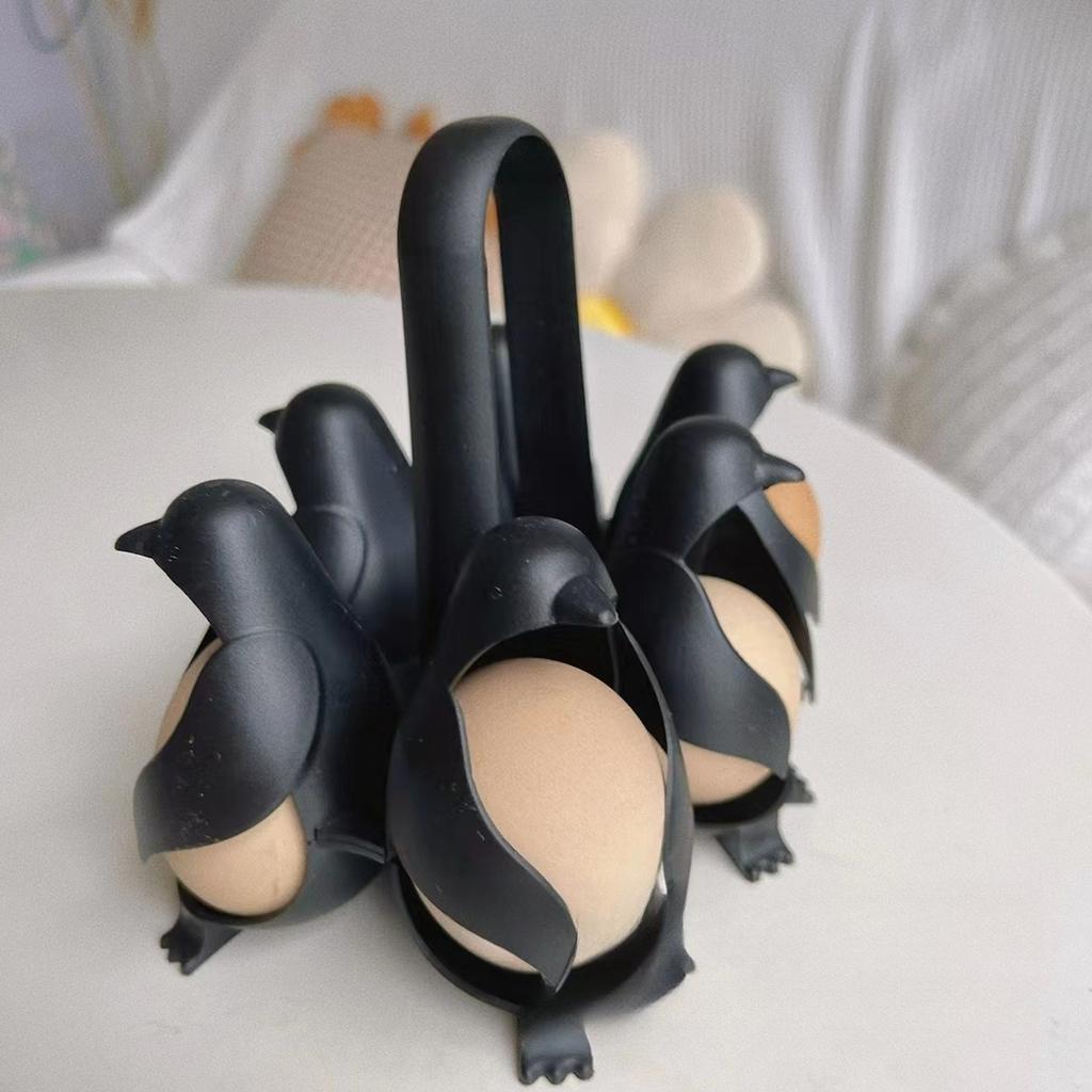 1 ks kuchyňské vychytávky: Vařič vajec tučňák, Nádoba na vaření vajec v páře, Držák na vejce