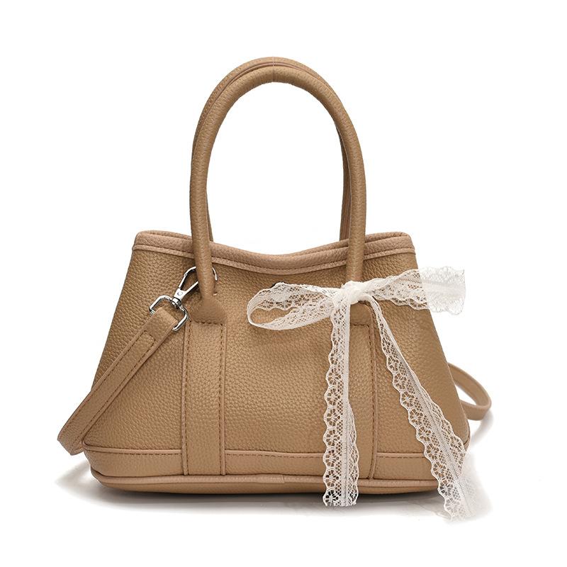 Korean fashion simple casual style portable bucket bag femininity high sense commuting versatile solid color messenger bag