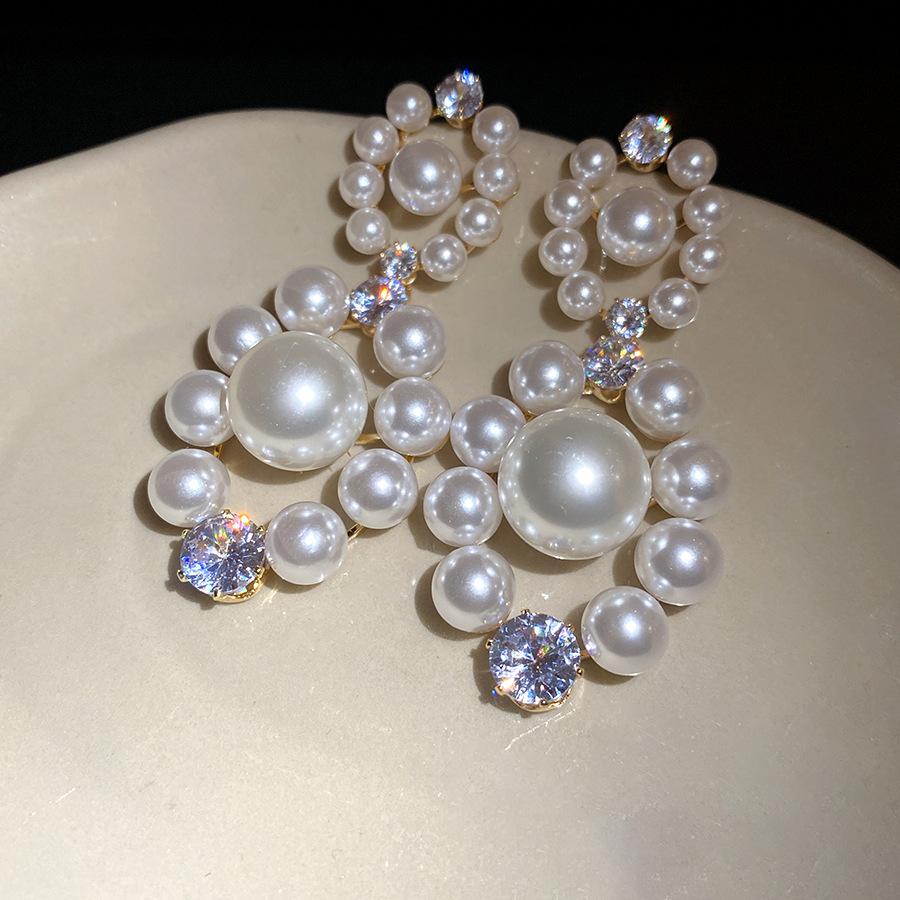 

Silver needle zircon pearl pendant earrings French retro temperament earrings light luxury high-end earrings design sense niche