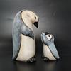 A Set of Two Resin Statues Featuring a Mother And Penguin Showcasing a Creative Family Theme These Can Serve As Decorative Pieces for Home