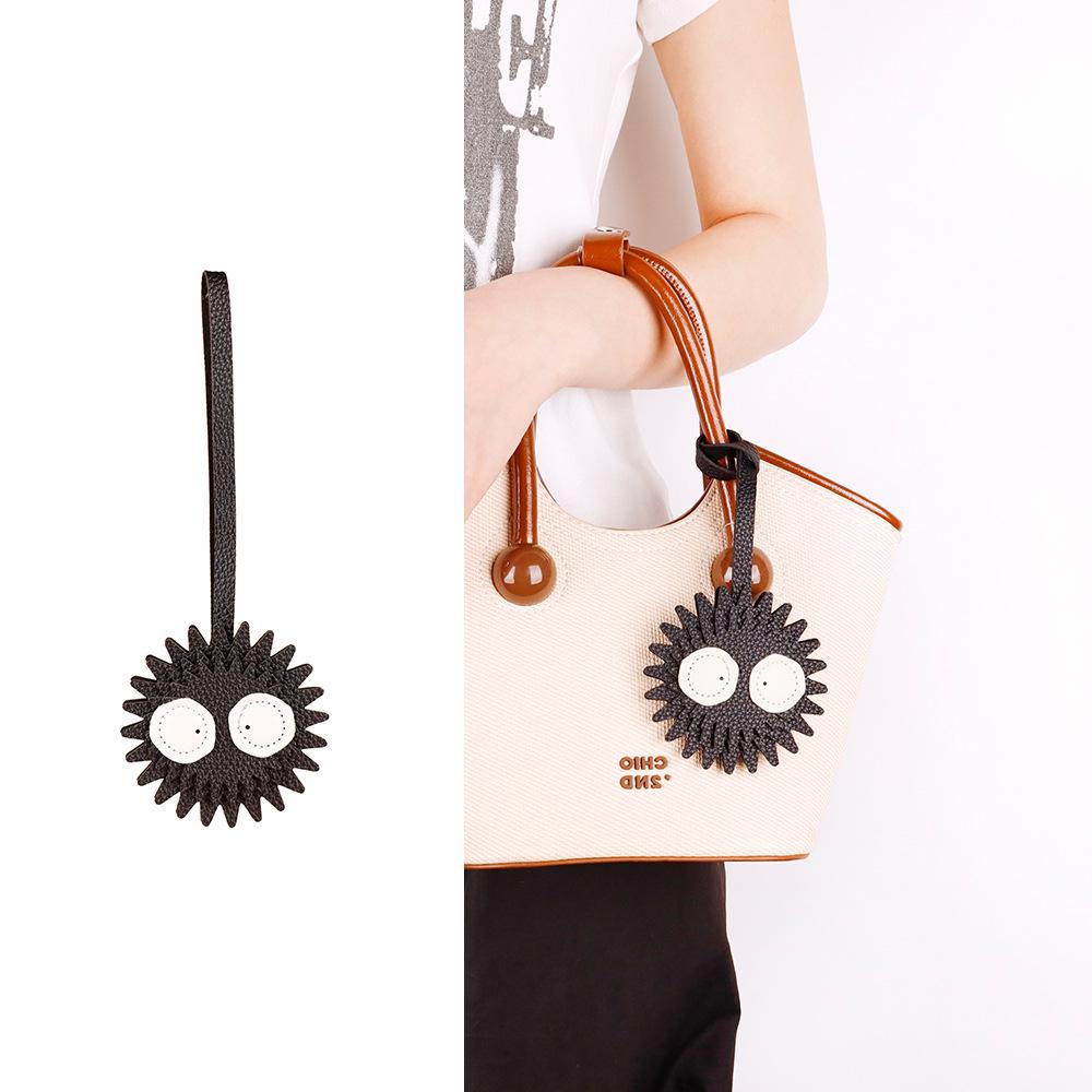

Creative Coal Ball Leather Bag Pendant: Trendy & Cute Ornament Accessory