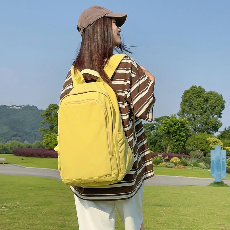 Solid color high-end backpack junior high school students casual simple travel large-capacity backpack